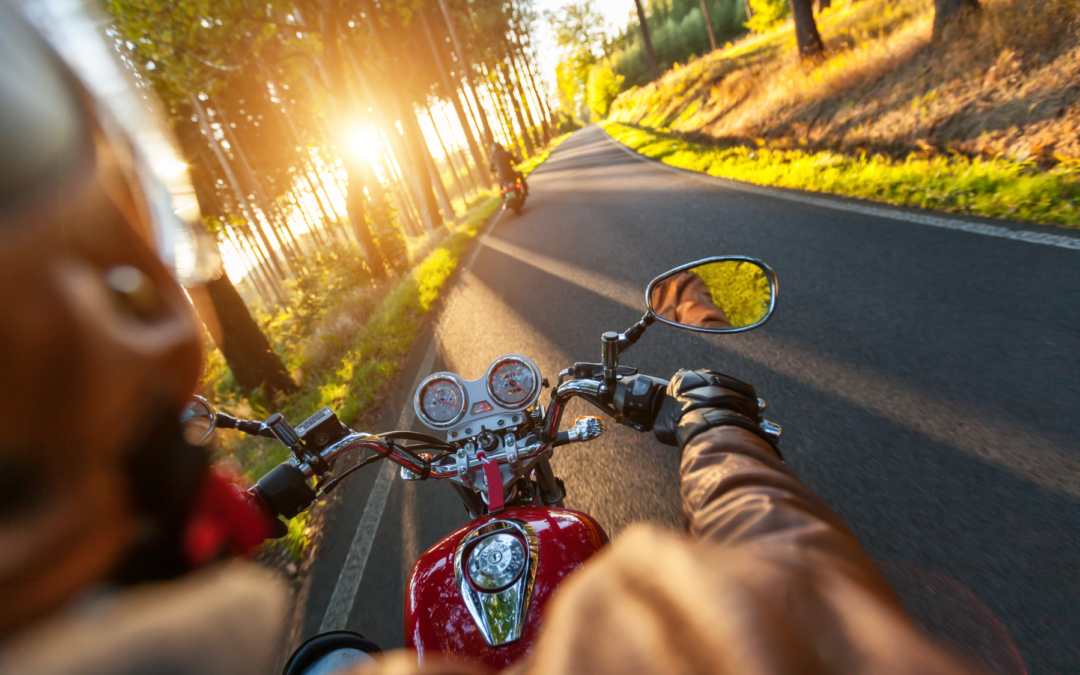 Motorcycle rider on a St. Petersburg road, highlighting the risks Florida motorcyclists face and the need for legal protection.